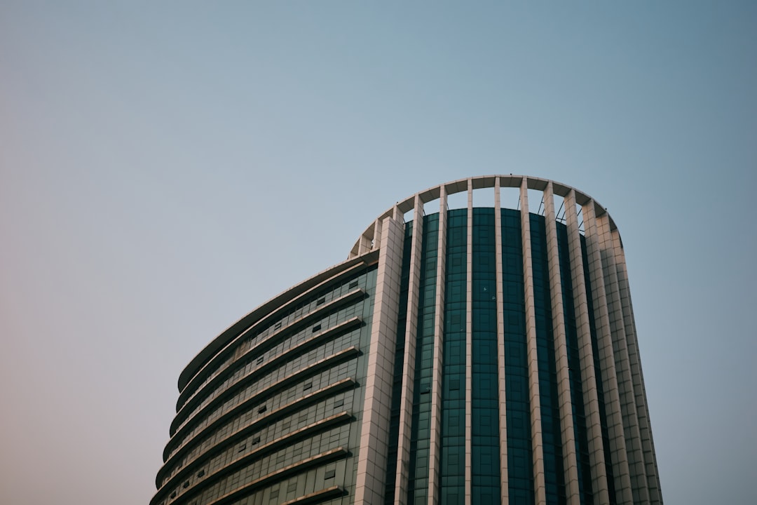 Modern curved skyscraper against a clear sky