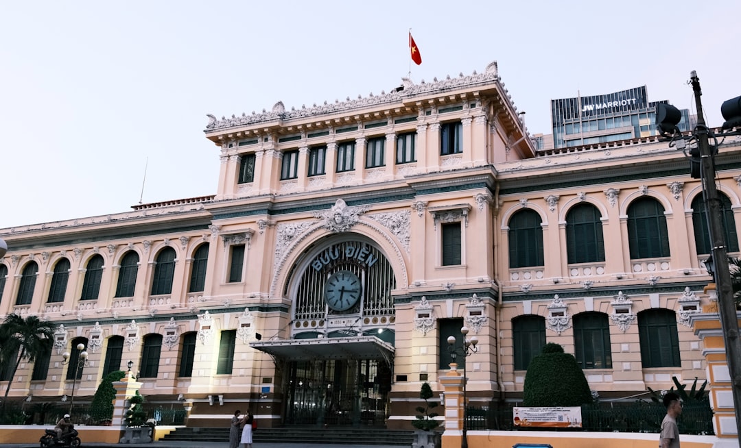 Historic colonial-era post office building with clock
