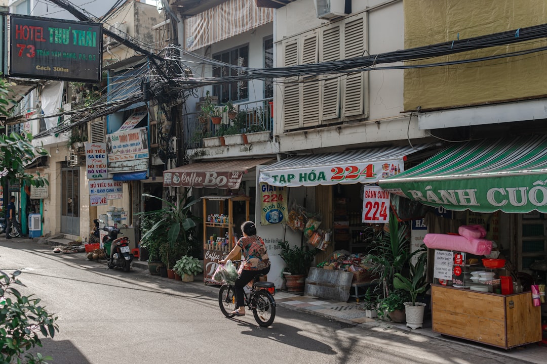 a person riding a bike down a street