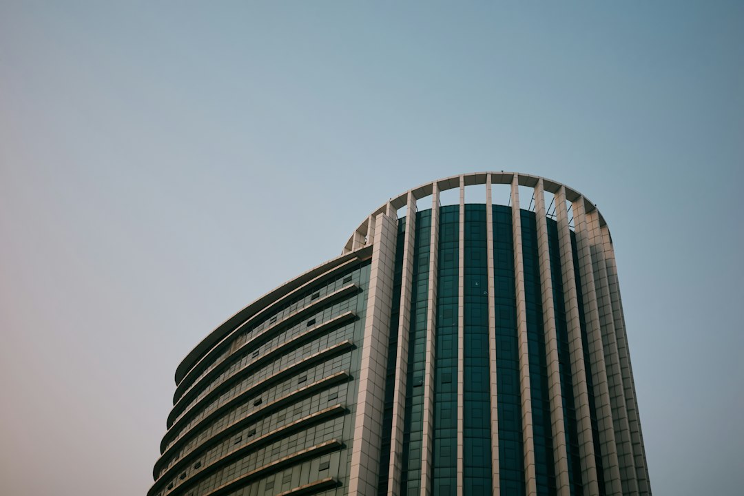 Modern curved skyscraper against a clear sky